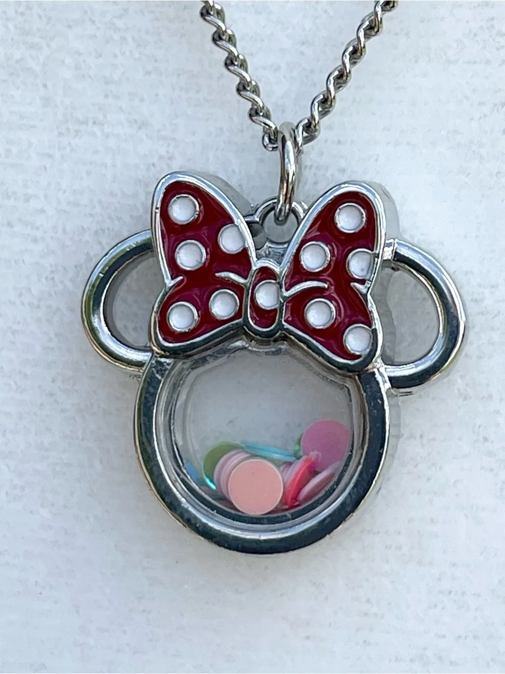 Minnie Mouse shaker charm on silver chain.